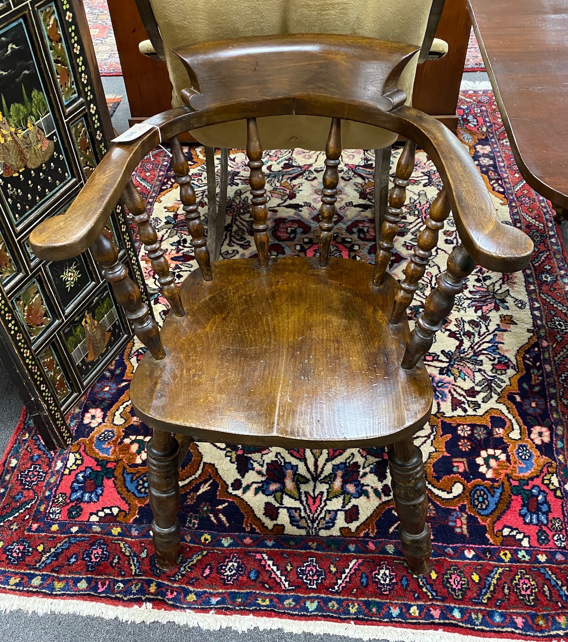 A Victorian elm and beech smoker's bow elbow chair, width 63cm depth 47cm height 82cm
